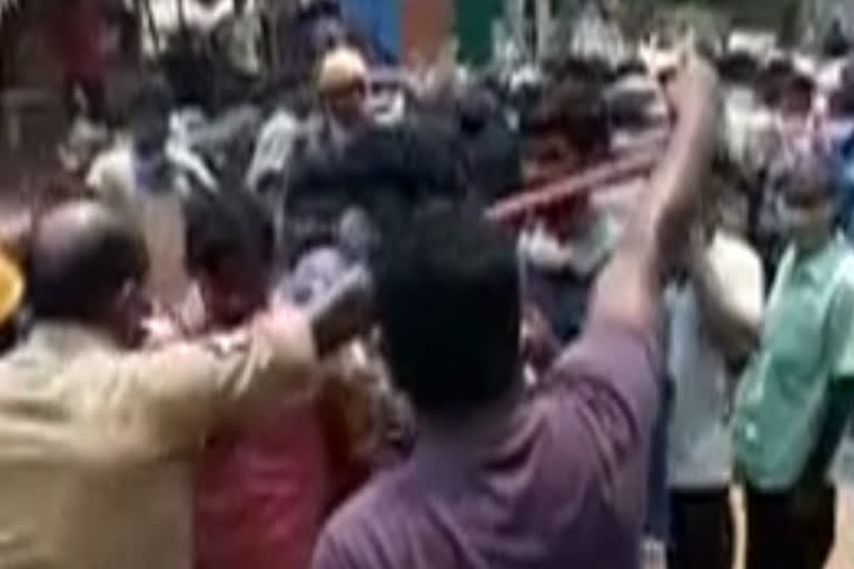 police baton charge at the liquor store