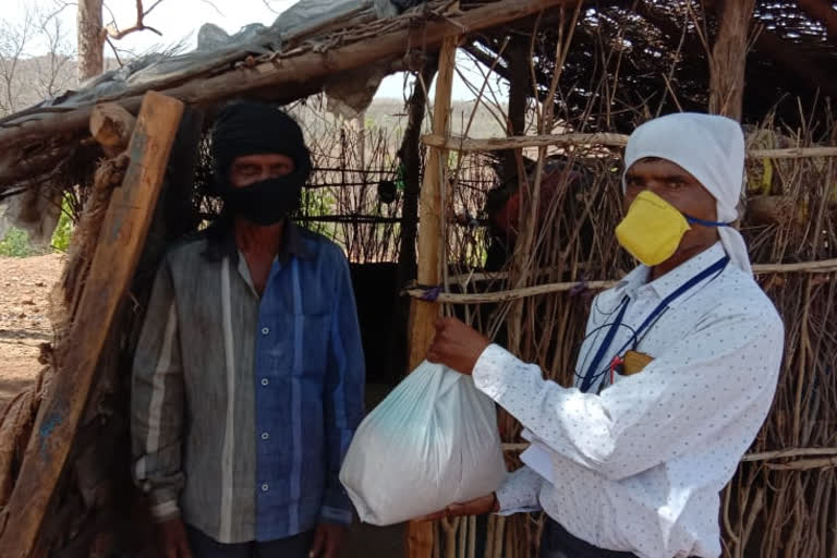 Municipality employees distributed packets of food grains from house to house