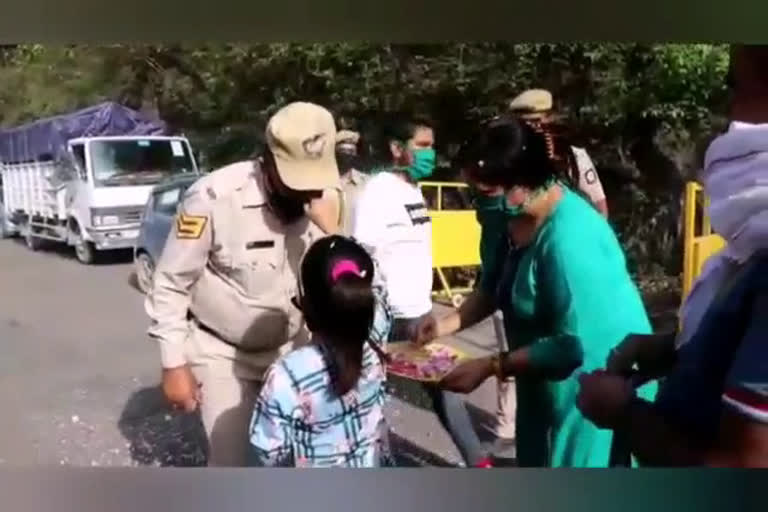 showering flowers on police personnel