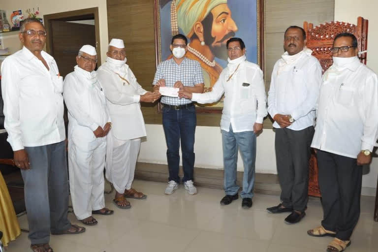 check of Rs. 1 lakh to C.M's Assistance Fund on behalf of Khandgaon Devasthan