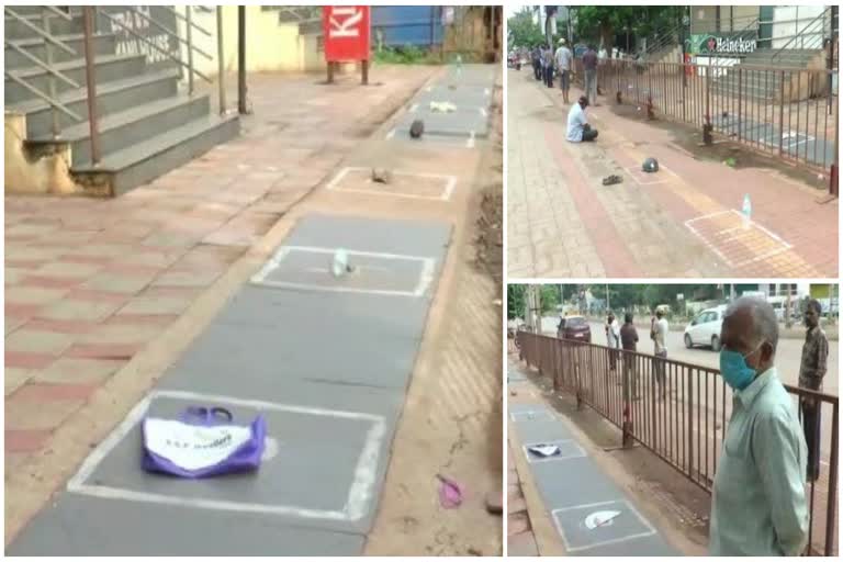 Customers reserve their place by water bottles, shoes and helmets in front of the liquor store.