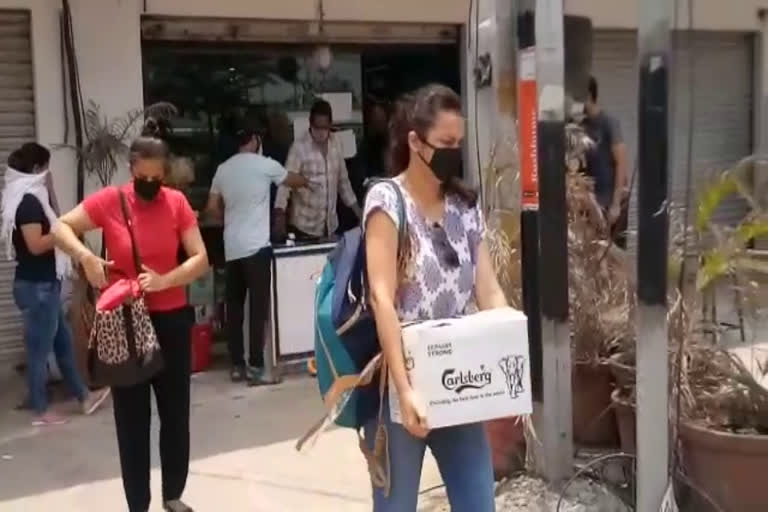 women waiting at Que lines at liquor shops hyderabad