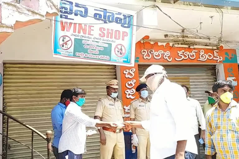 Distribution of tokens to liquor people in markapuram  prakasam district