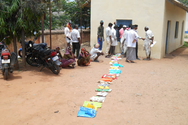 People rush in front of bank at kushtagi