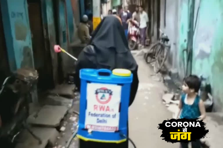 Muslim woman wearing burqa doing sanitization in mustafabad amid coronavirus outbreak