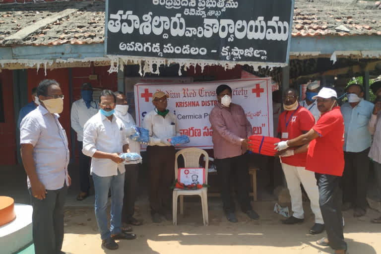 red cross members distributes mask and ppe kits in krsihna dst avingadda