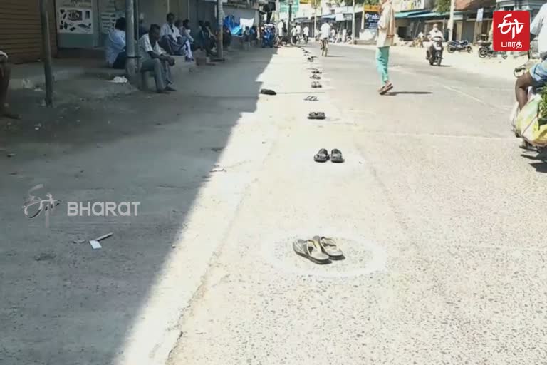 drinkers in kaancheepuram reserve their queue to slippers  for buying liquor