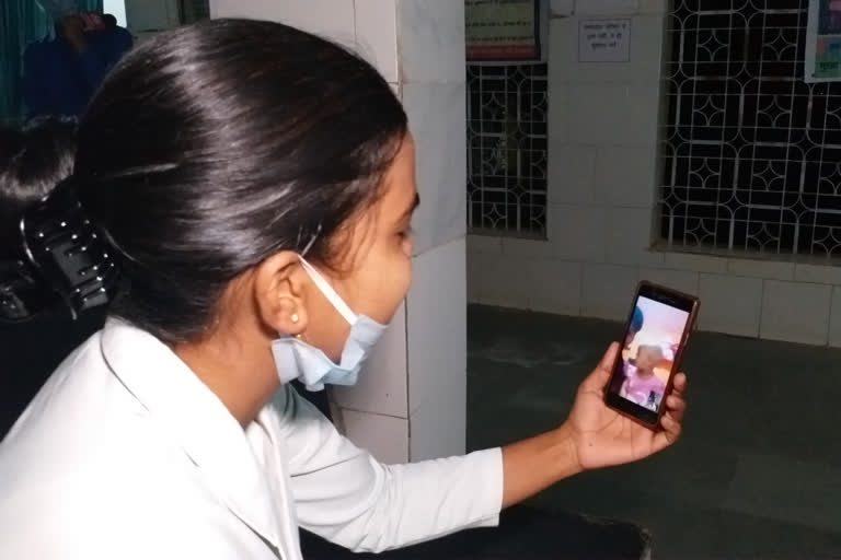 Nurse Poonam while talking to her child using WhatsApp