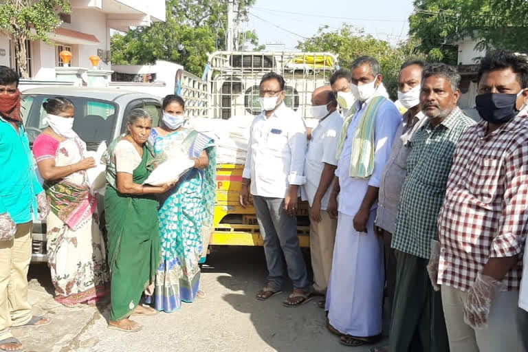 tdp leaders distributing essential goods to poor people in  addanki