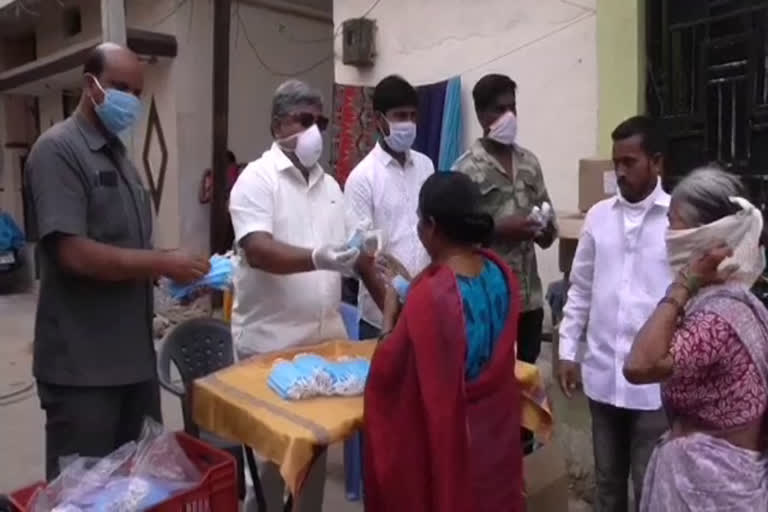 aicc leader guduru narayana reddy distributed sanitizers and masks at addagutta secunderabad