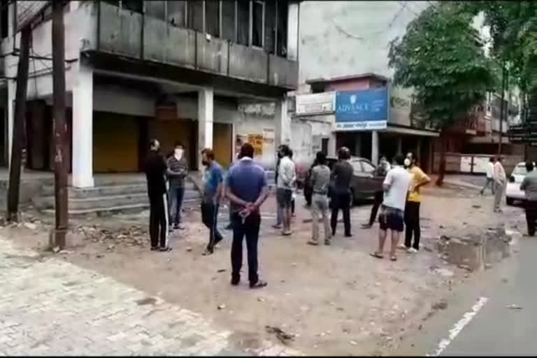 liqueur lovers were standing outside the shop during storm in ghaziabad