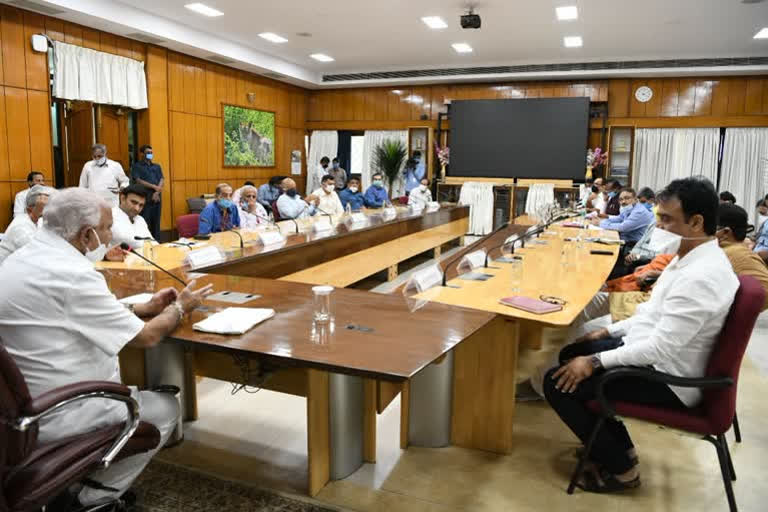 Chief Minister B S Yediyurappa and officials