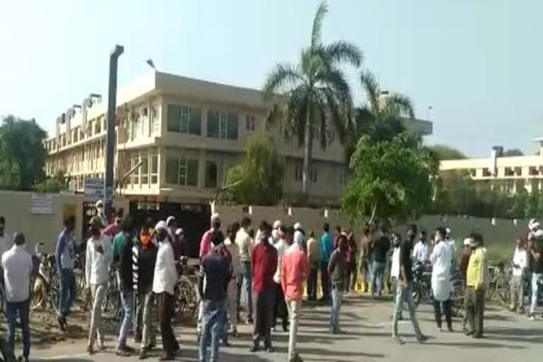 workers protest outside euro footwear company demanding payment of salary in unnao