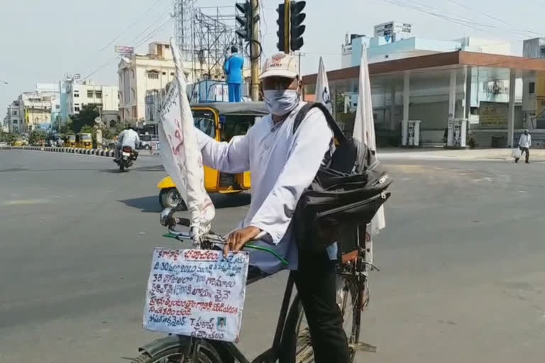 bhdhradri resident bicycle trip to give awareness on corona crisis