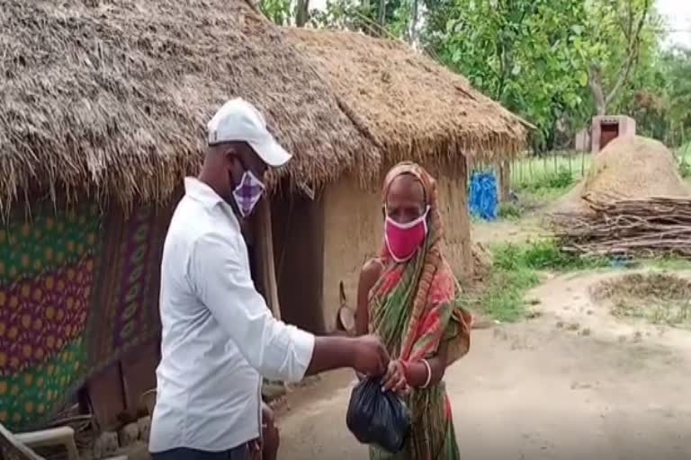 The Ghasipura block social worker distributing food masks to the needy people