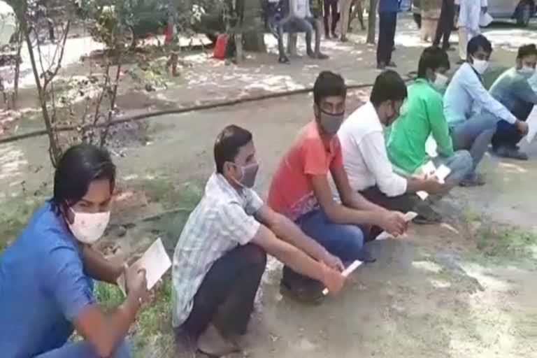 migrant laborers arrived at government hospital in gurugram to get health certificate