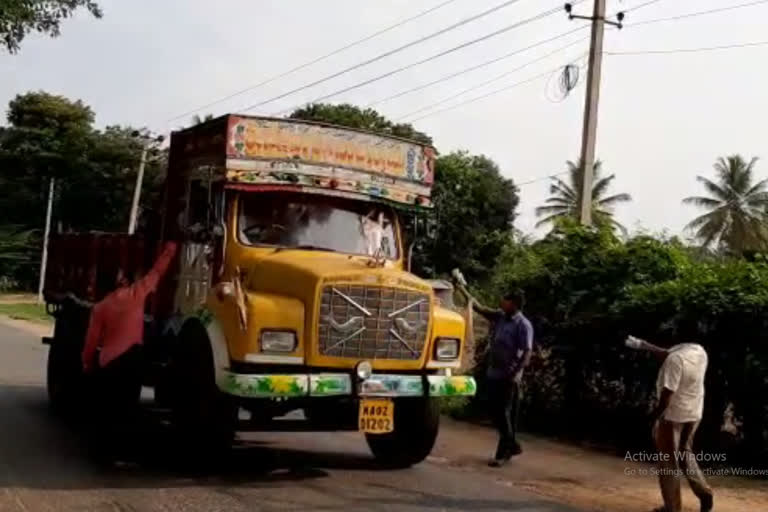 Journalist distributing food to Lorry drivers