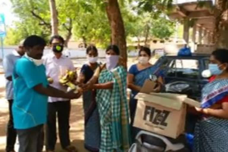 tiffin distributed to sanitation workers by anganwadi staff at rajampet in kadapa district