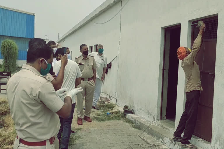 A worker of UP resident hangs in the factory room in ganaur