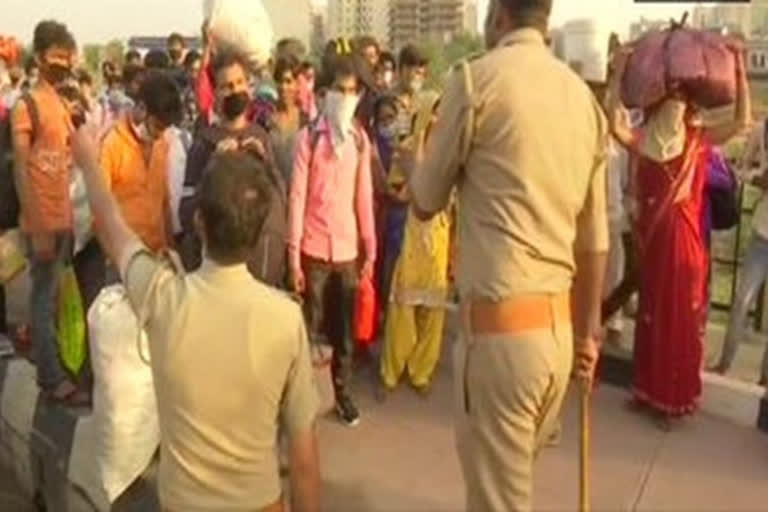 Stranded migrant workers walk towards their hometowns from Delhi