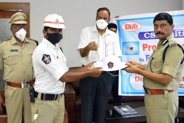 divis laboratories given caps to police in vizag