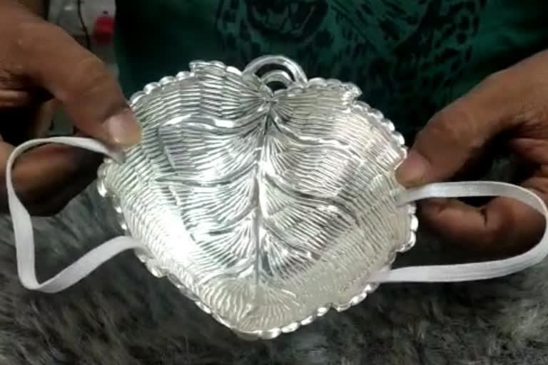 jeweler manufactures silver masks