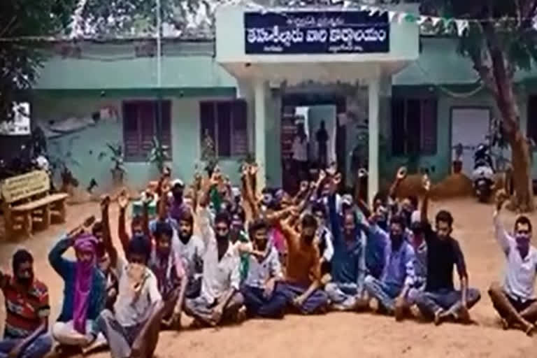 Migrant laborers protest in front of Lingapalem Tahsildar's office