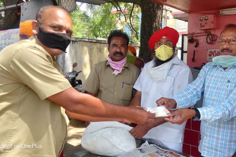 Distribution of Buttermilk Packet to workers at Karimnagar RTC Depot