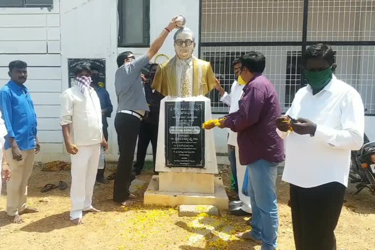 tdp followers helds palabhishekam for ambedkar statue