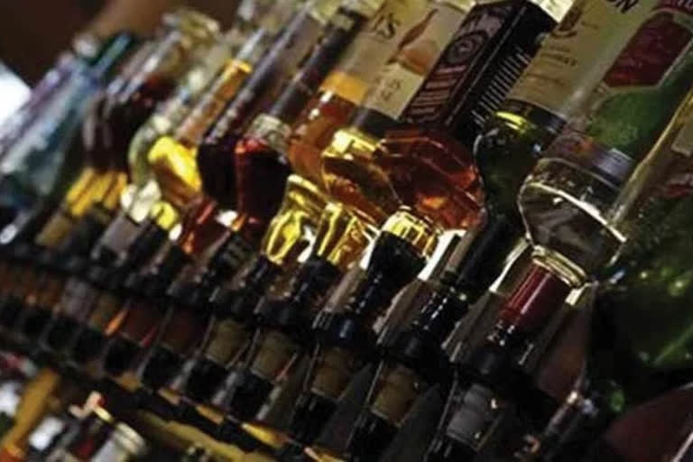 officials take over liquor bottles from constables in krishna district