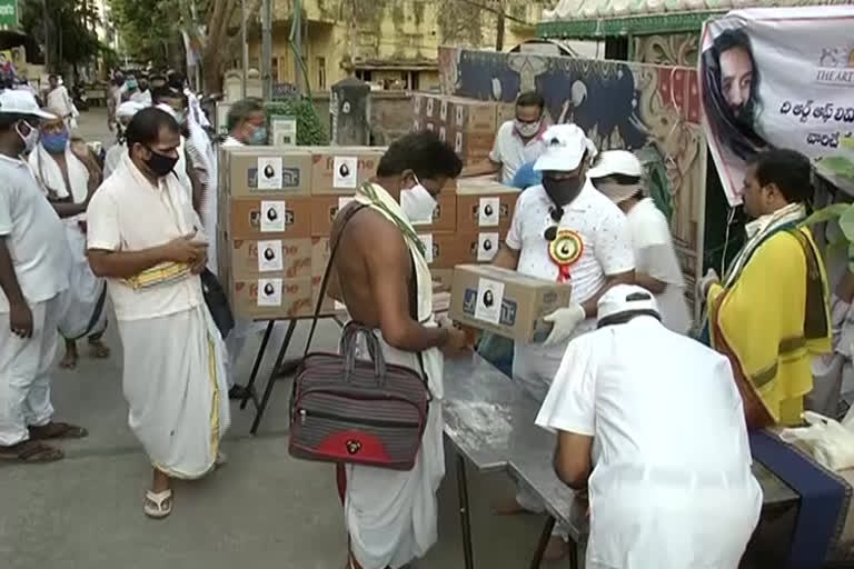 art of living charity   distribution of  needs to poor at vijayawada