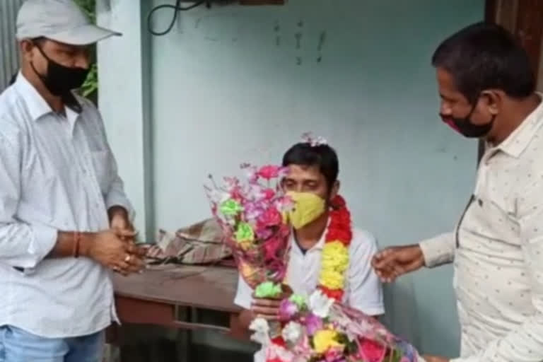 Locals greeted the young man who recovered corona with garland at alipurduar