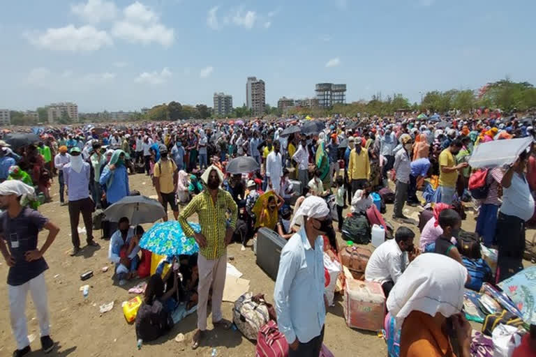 Thousands of migrant workers wait at Vasai to board special train