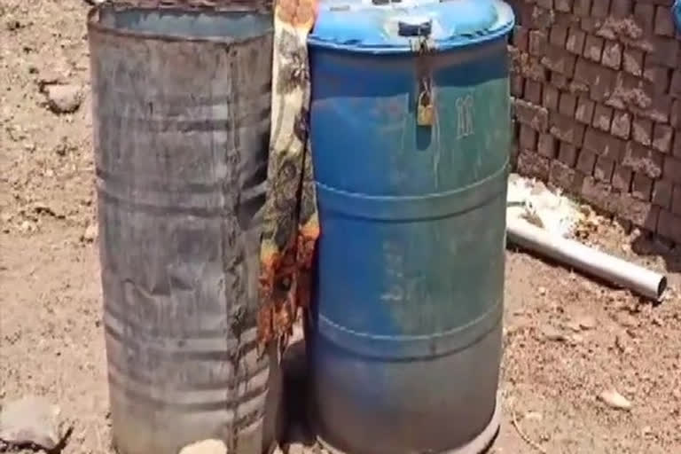 Locals in Jhabua keep water-filled drums locked to prevent theft