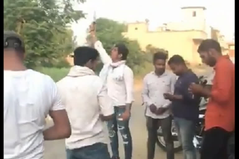 Youths firing gun