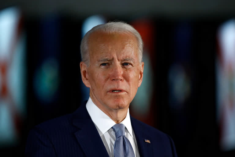 Biden speaks of racial 'open wound,' contrasting with Trump