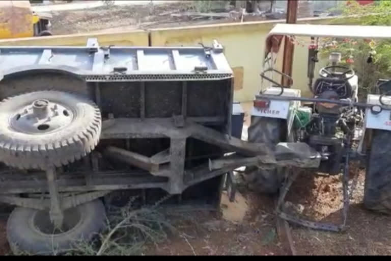 tractor trolley filled with wheat overturned