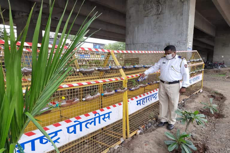 Traffic police officer Nashik planted flower garden from water bottles