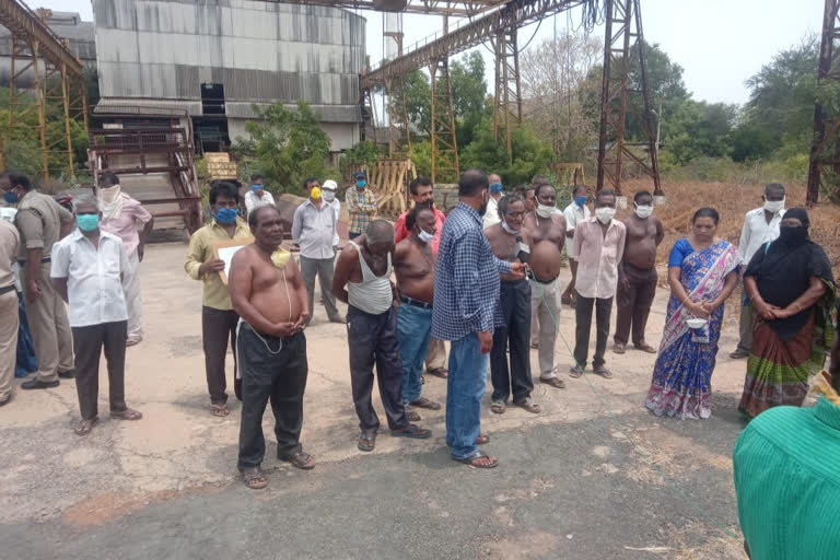 nellore dst sugar factory workers protest for their wages