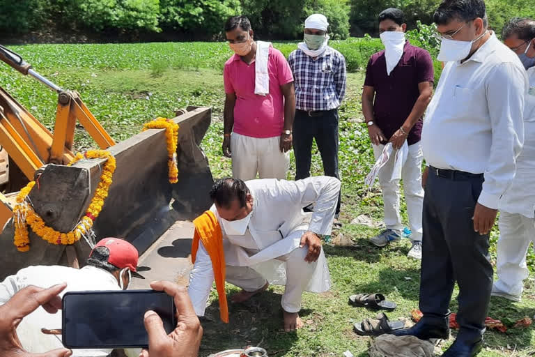 collector and mla doing bhoomi pujan