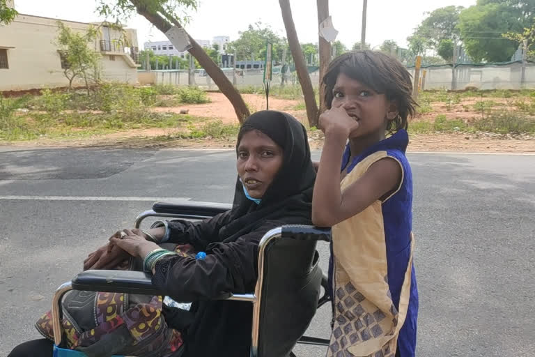 Little Girl Who carries Her Mother in Wheel-chair