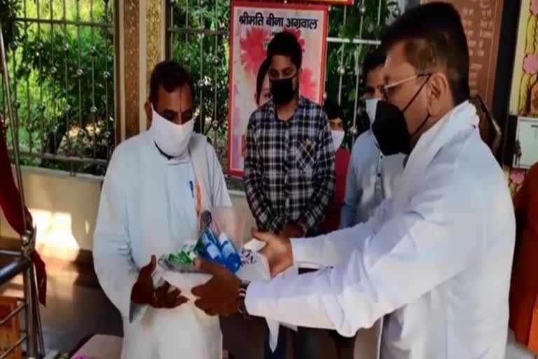 BJP MLA distributes masks, sanitisers, PPE kits to priests in Moradabad