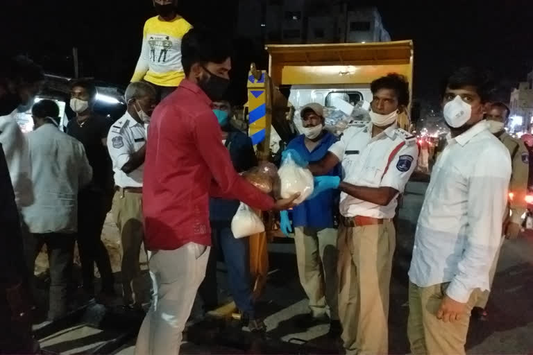 groceries distribution by art of living organization to auto drivers in Hyderabad