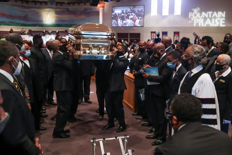 Pallbearers recess out of the church with the casket following the funeral for George Floyd on Tuesday.