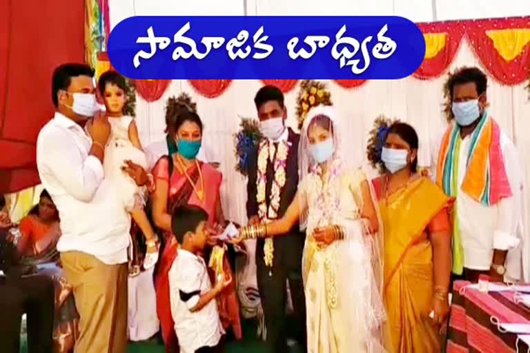 masks and sanitizers distribution to marriage guests in mandamarri