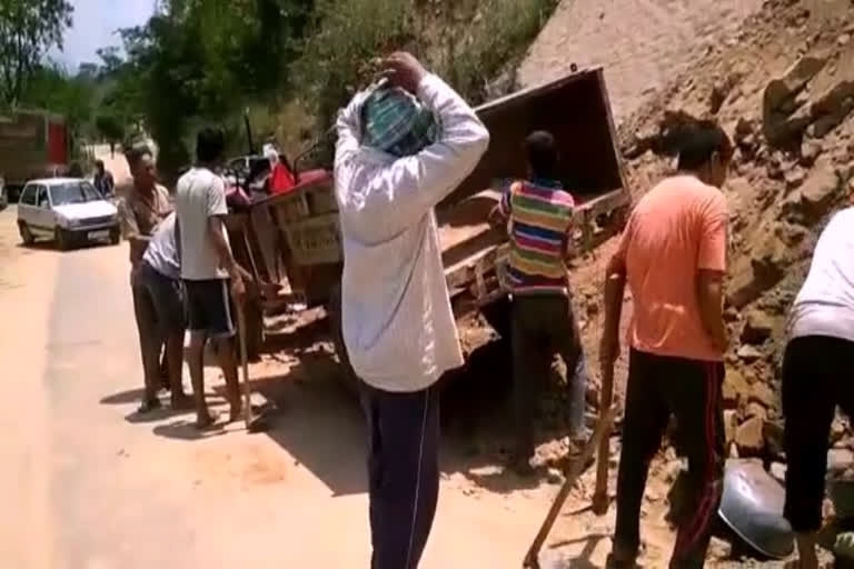 People repair road in Swarghat