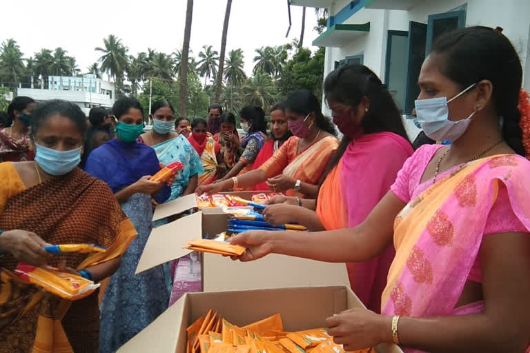 teacher distributing sanitary pads, napkins to poor ladies in ravulapalem constituency