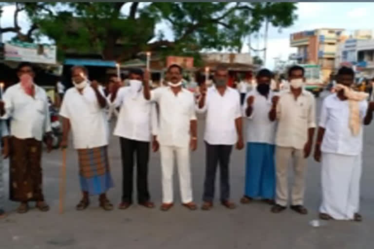 tdp leaders protest with candles in udayagiri nellore district