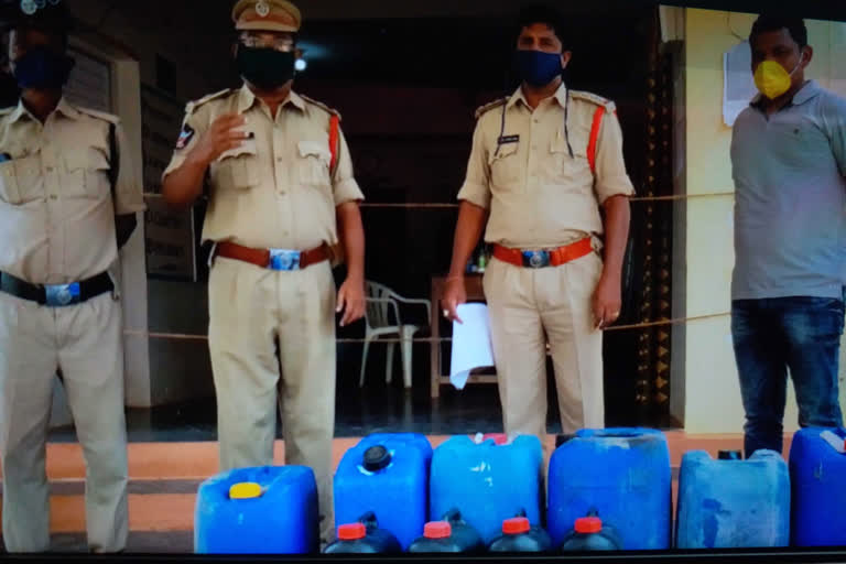 raw liquor seized by narsipatnam police in visakhapatnam district