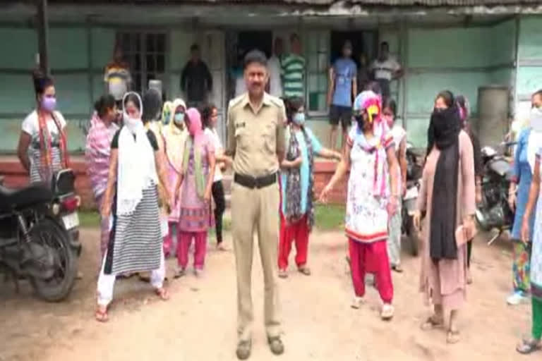 a constable of police faced anger of hundreds of women in nagaon